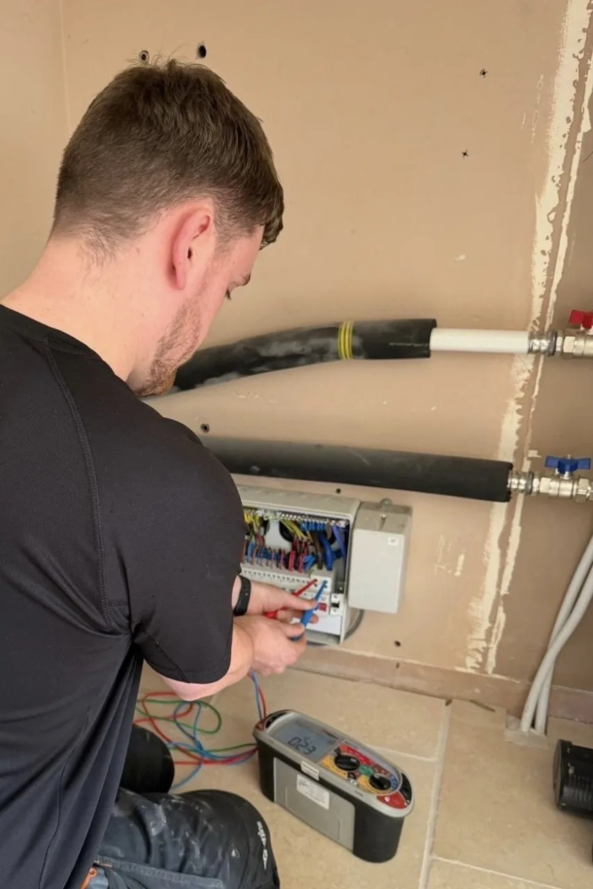 Henry Thomas of Yorkshire Electrical and Renewables testing a consumer unit