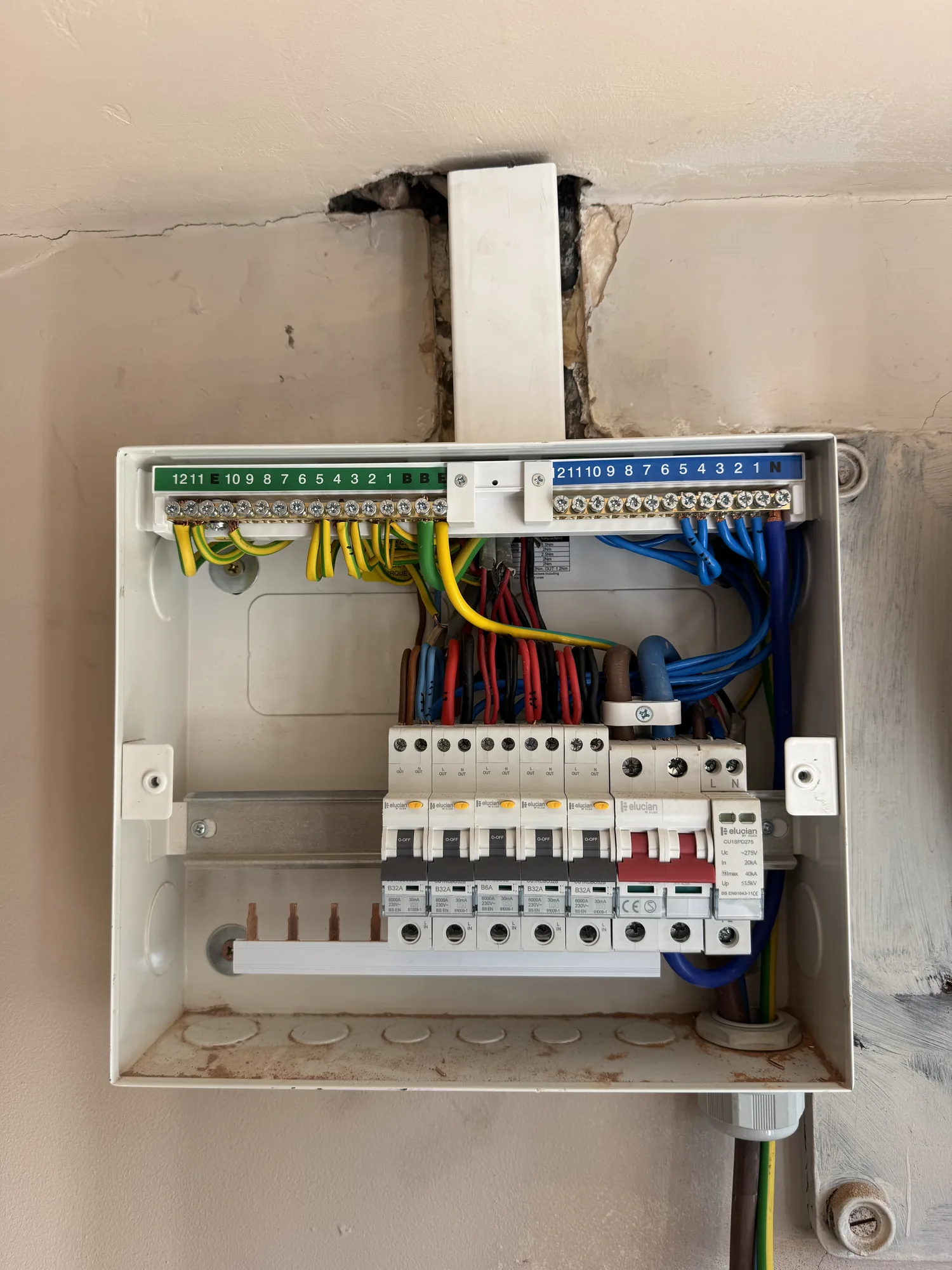Consumer unit mid-installation with new breakers and tidy wiring