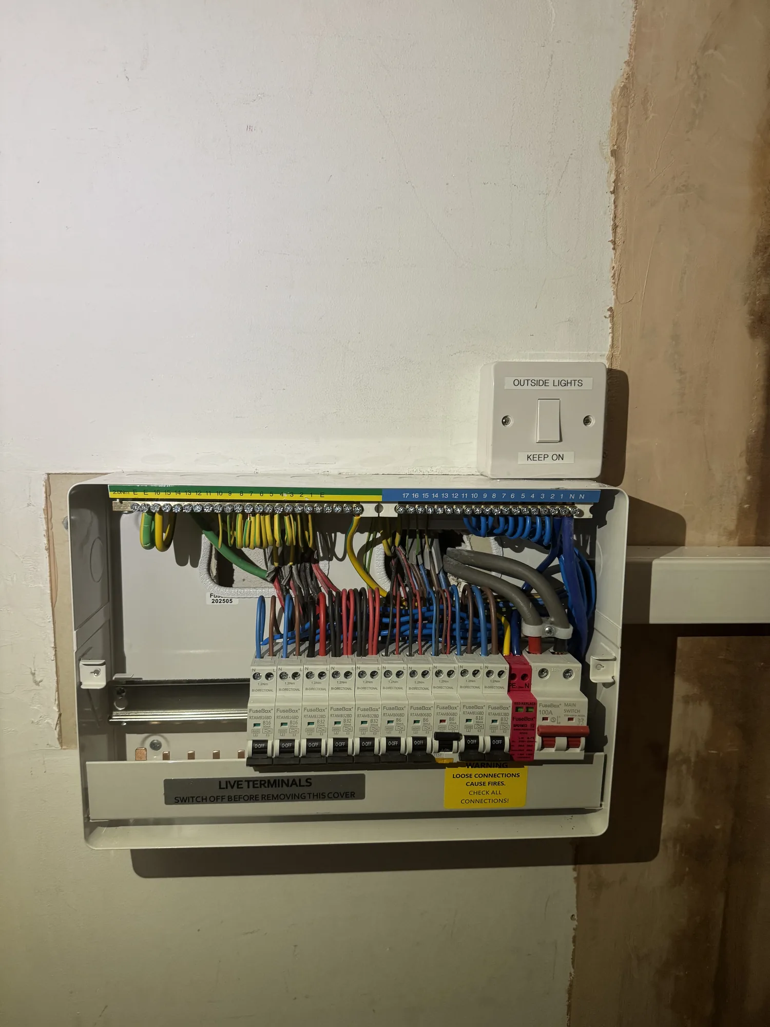 New consumer unit fitted beside an outside lights switch