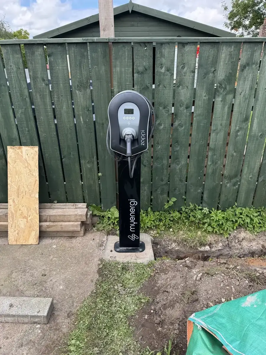 Pedestal-mounted EV charging post installed in a back garden