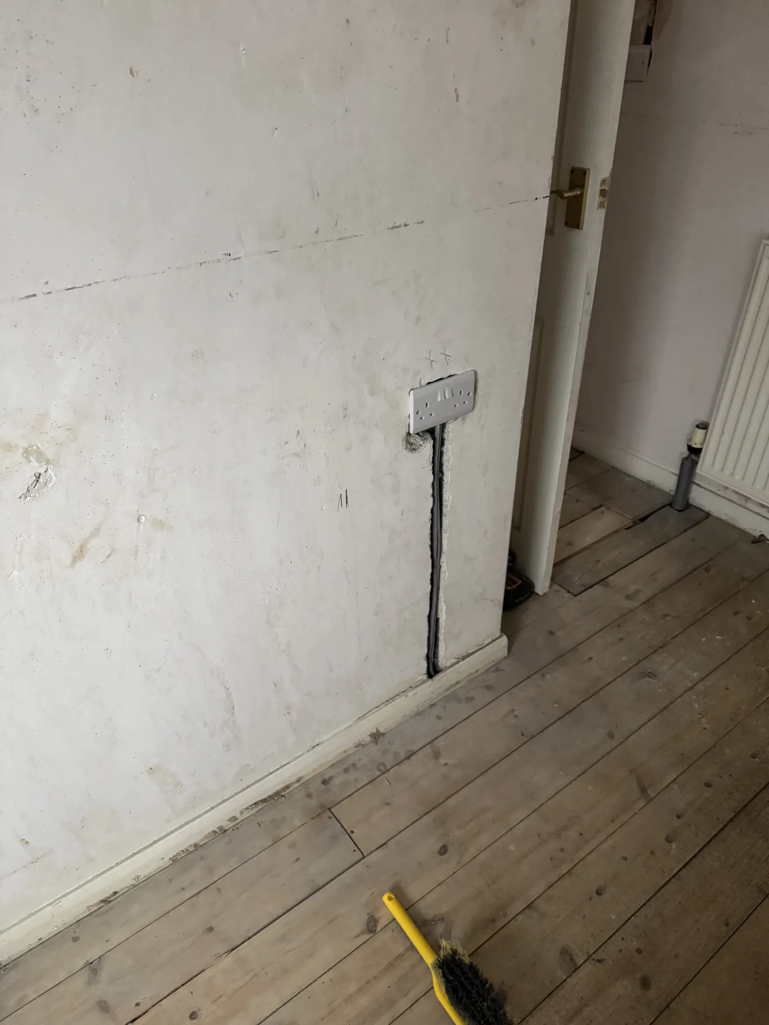 Chased wall with new cable drop to a socket during a rewire