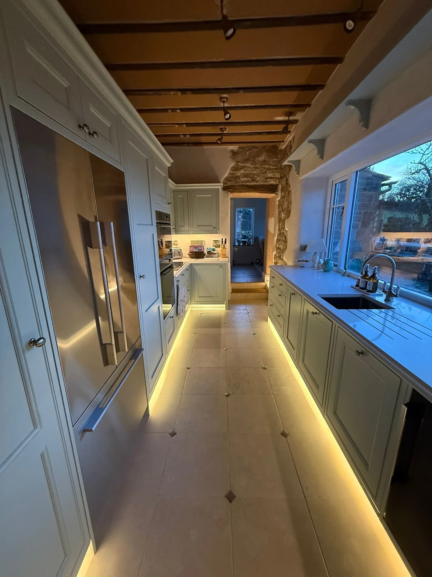 Finished kitchen with LED plinth and under-cabinet lighting after a rewire