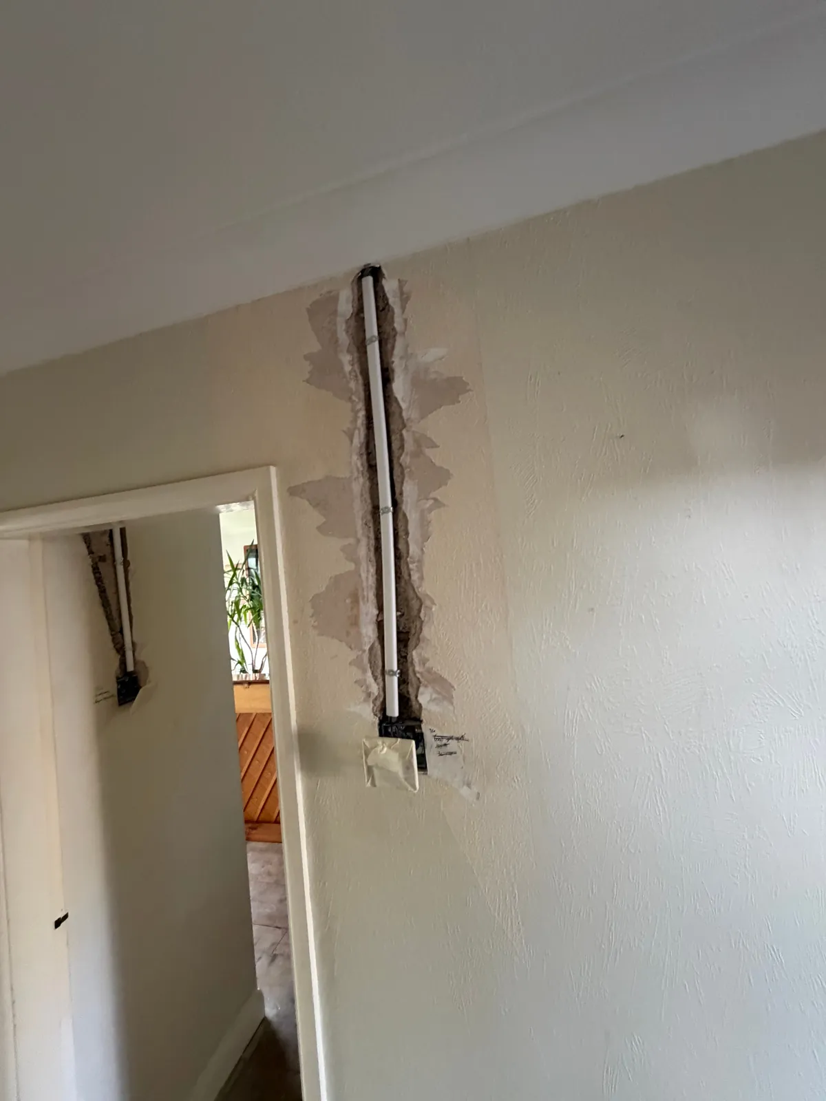 Chased wall with new cable drop to a light switch on a landing