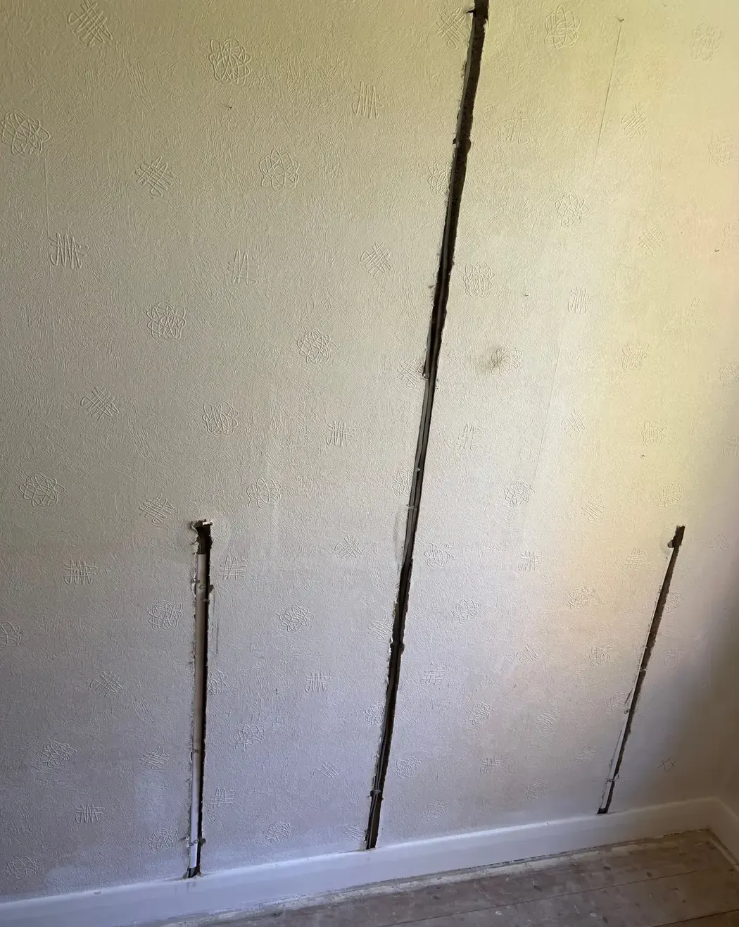 Chased cable runs for new sockets and a switch during a rewire