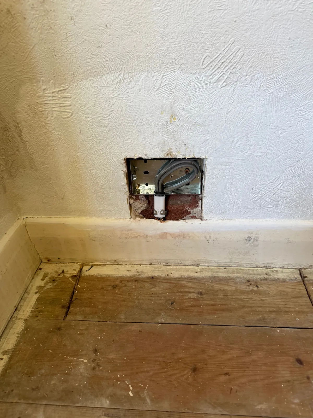 New metal back box fitted at skirting level